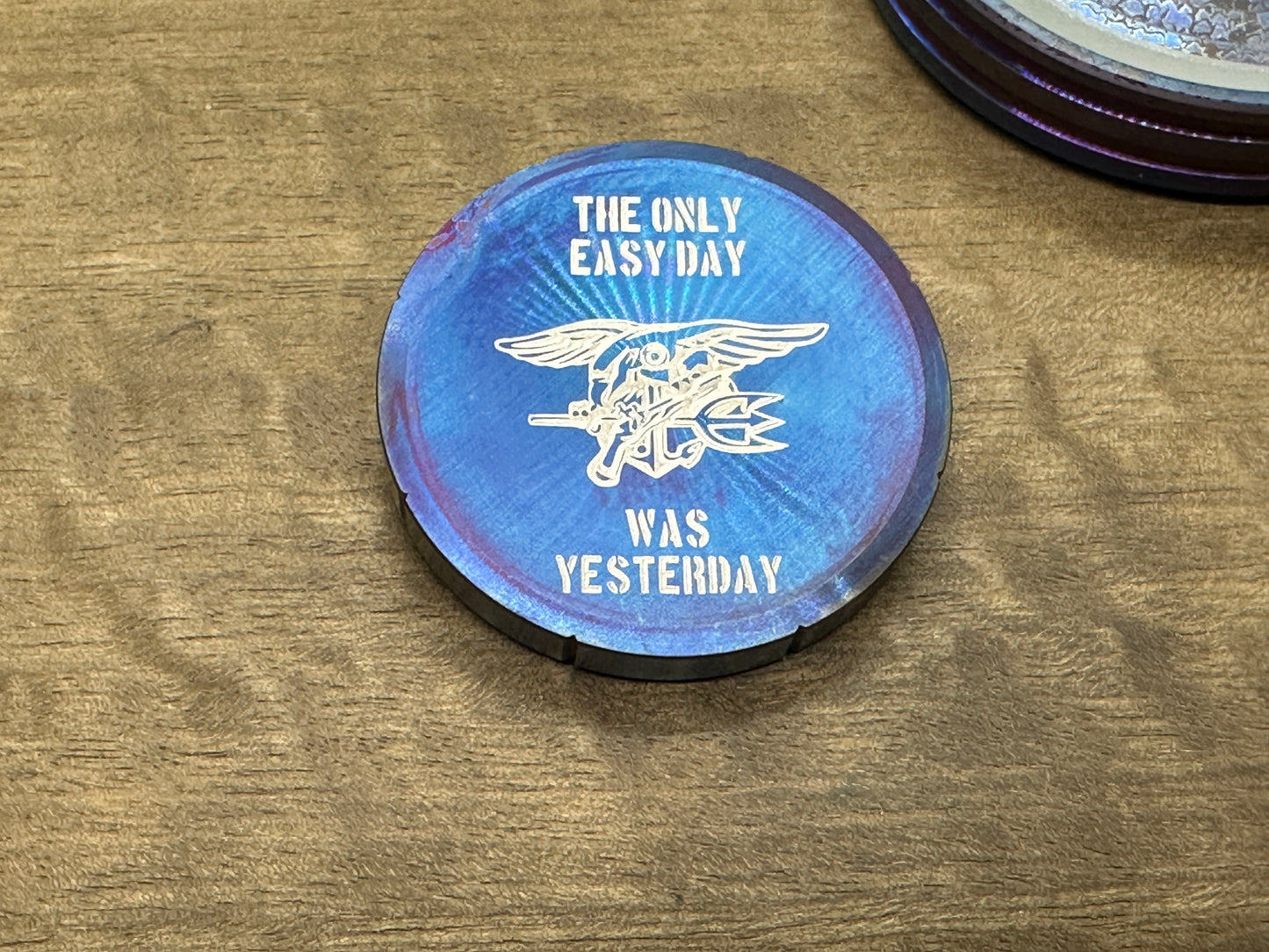 "The only easy day was yesterday.” Flamed Stainless Steel Spinning Worry Coin