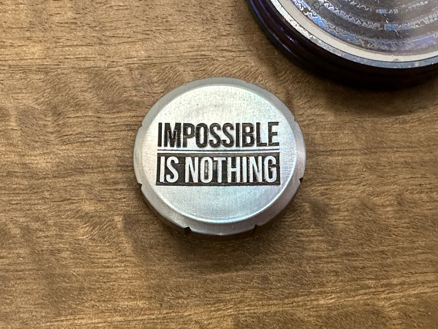 Impossible is Nothing Flamed engraved Greek Ascoloy Spinning Worry Coin