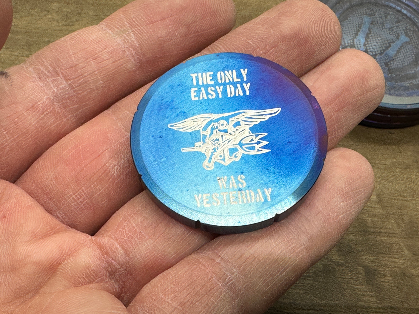"The only easy day was yesterday.” Flamed Titanium Spinning Worry Coin